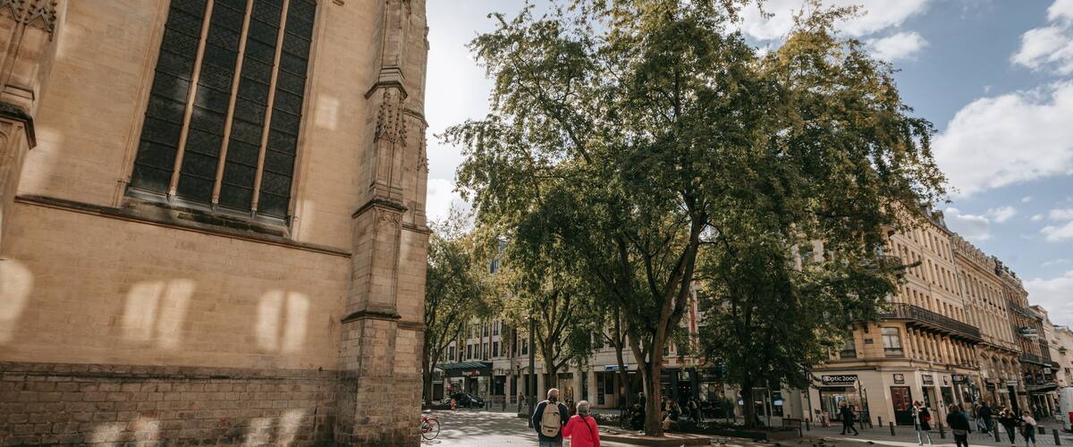 Saint-Étienne Church which includes street scenes and a city as well as a couple