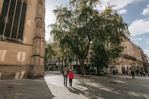 Saint-Étienne Church which includes street scenes and a city as well as a couple