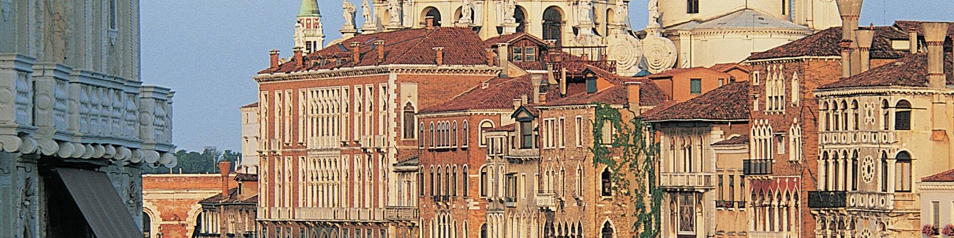 A canal in Venice with historic buildings and boats.