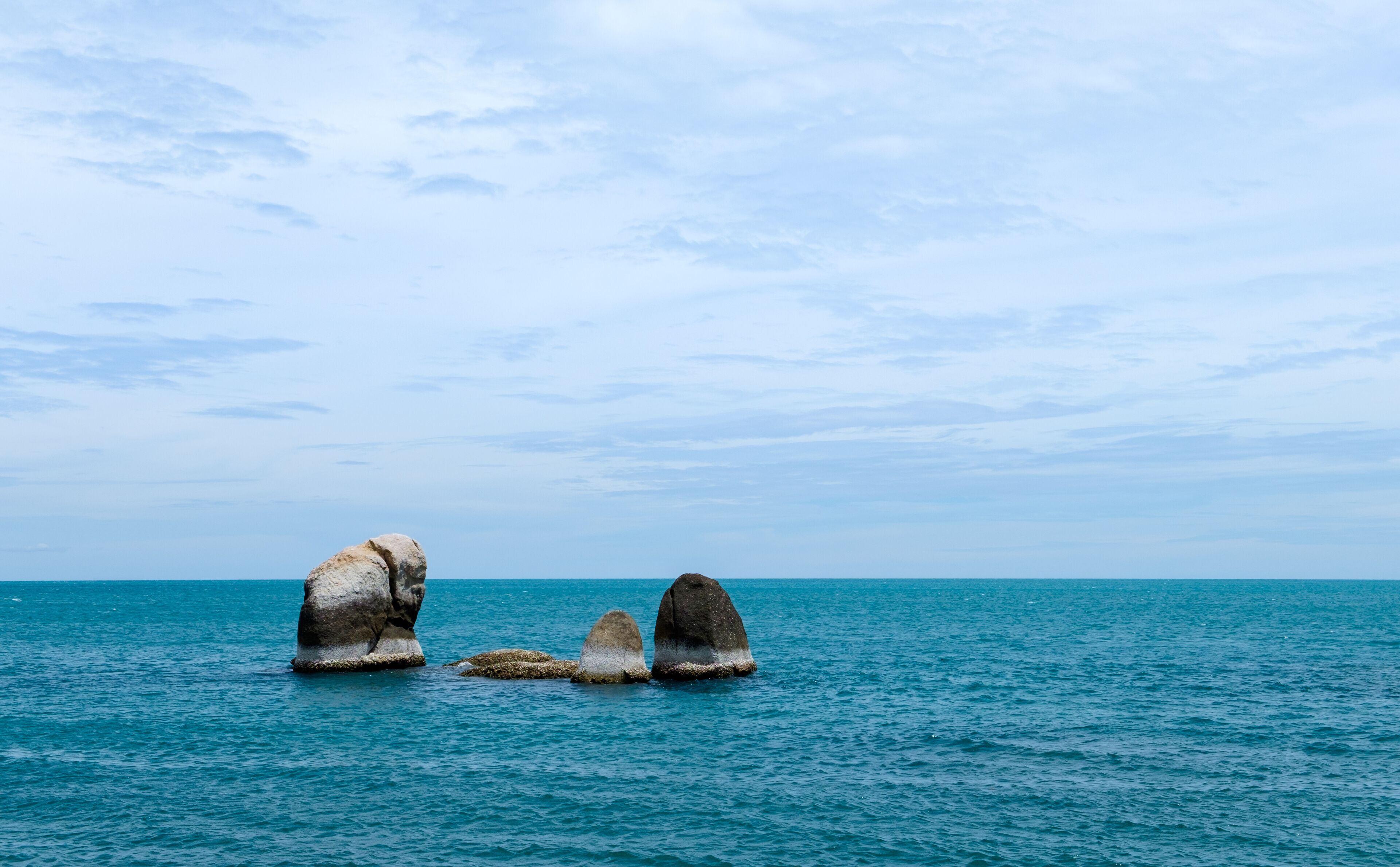 Beach with rocks in sea at attraction in Samui Island, Thailand