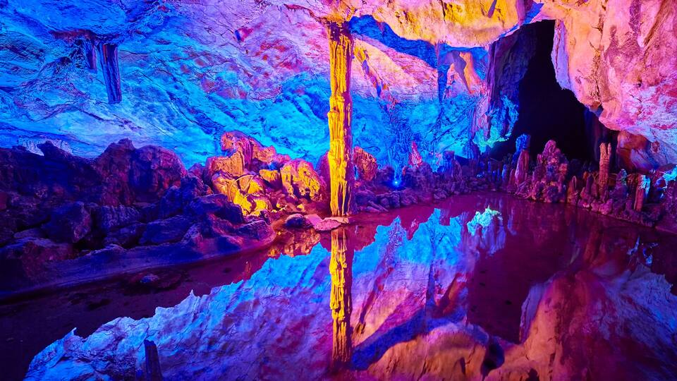 The Reed Flute Cave, natural limestone cave with multicolored lighting in Guilin, Guangxi, China.