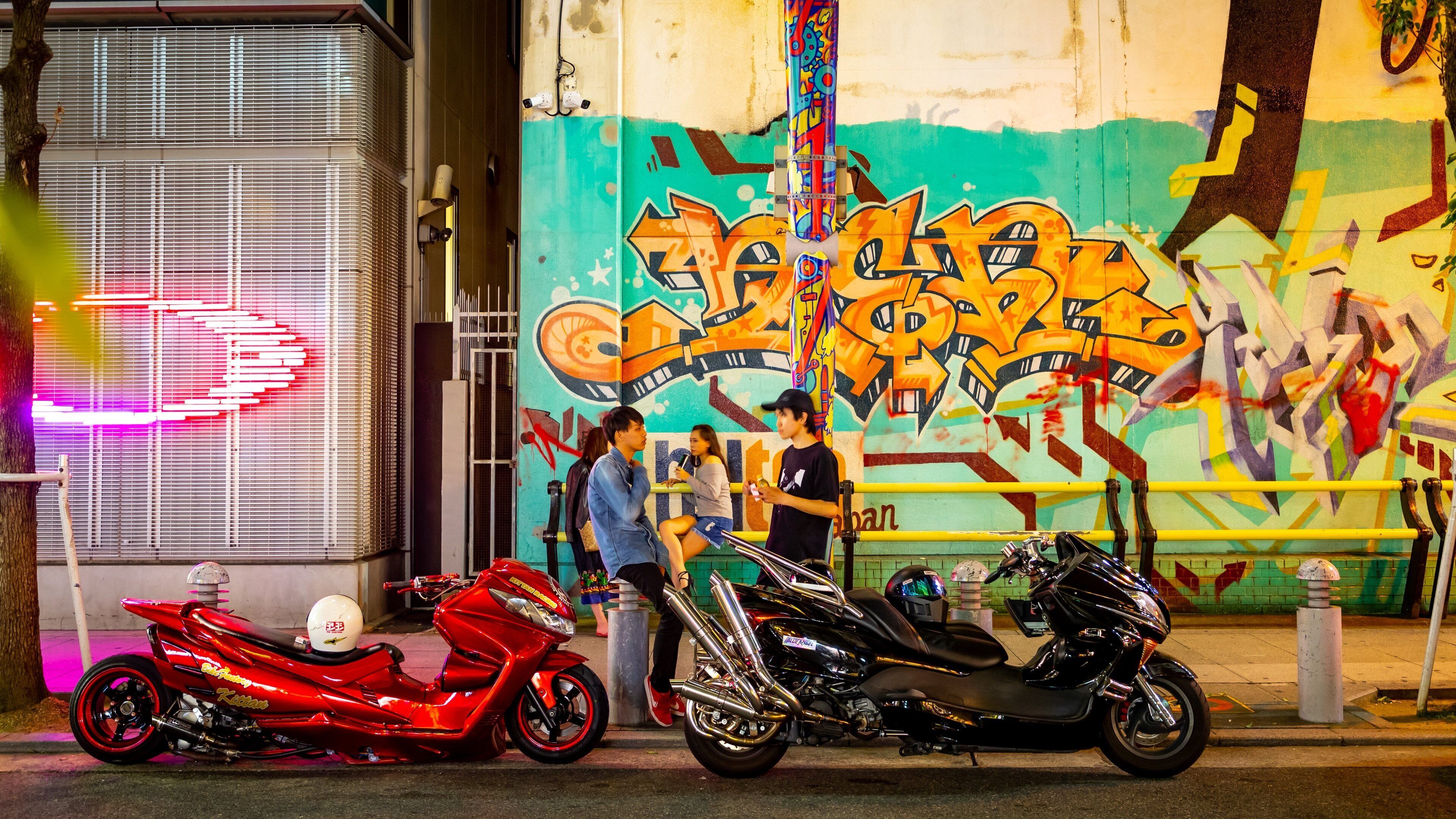 America Village showing outdoor art and street scenes as well as a couple