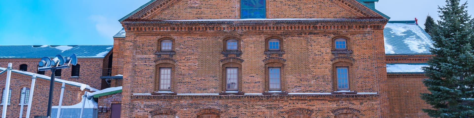 Sapporo Beer Museum with Snow in winter season. landmark and popular for attractions in Hokkaido, Japan. Travel and Vacation concept