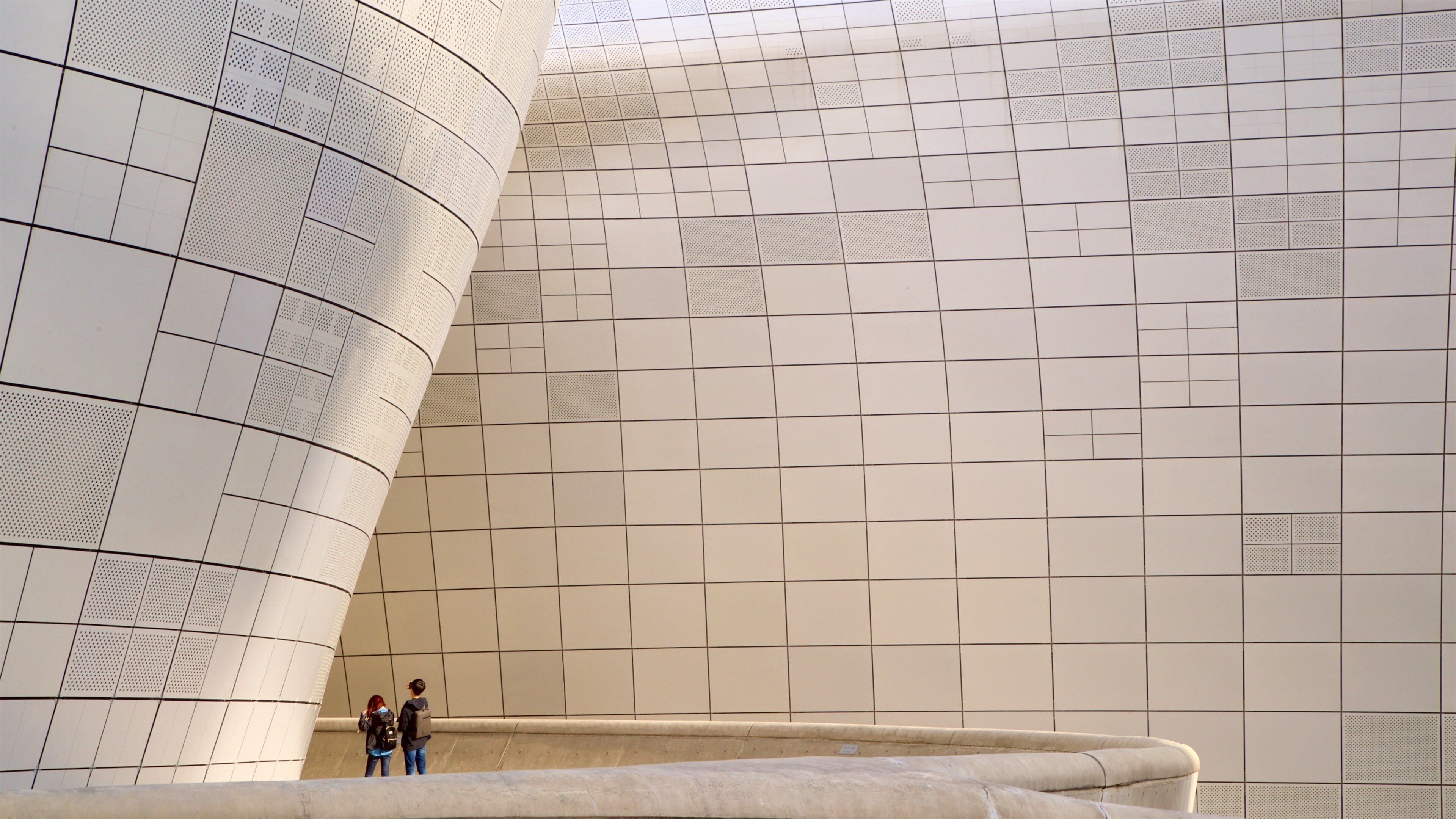 Dongdaemun Design Plaza featuring modern architecture as well as a couple