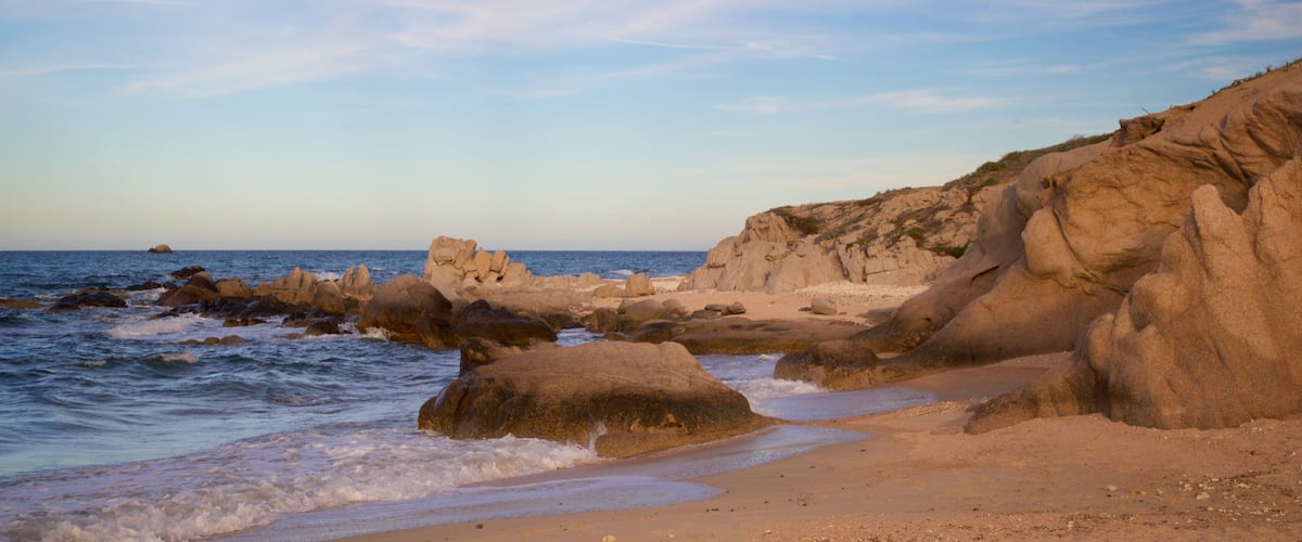 Los Arbolitos Beach featuring a sunset, rugged coastline and general coastal views
