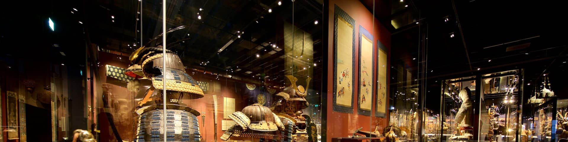 A museum exhibit with ancient armor and artifacts.
