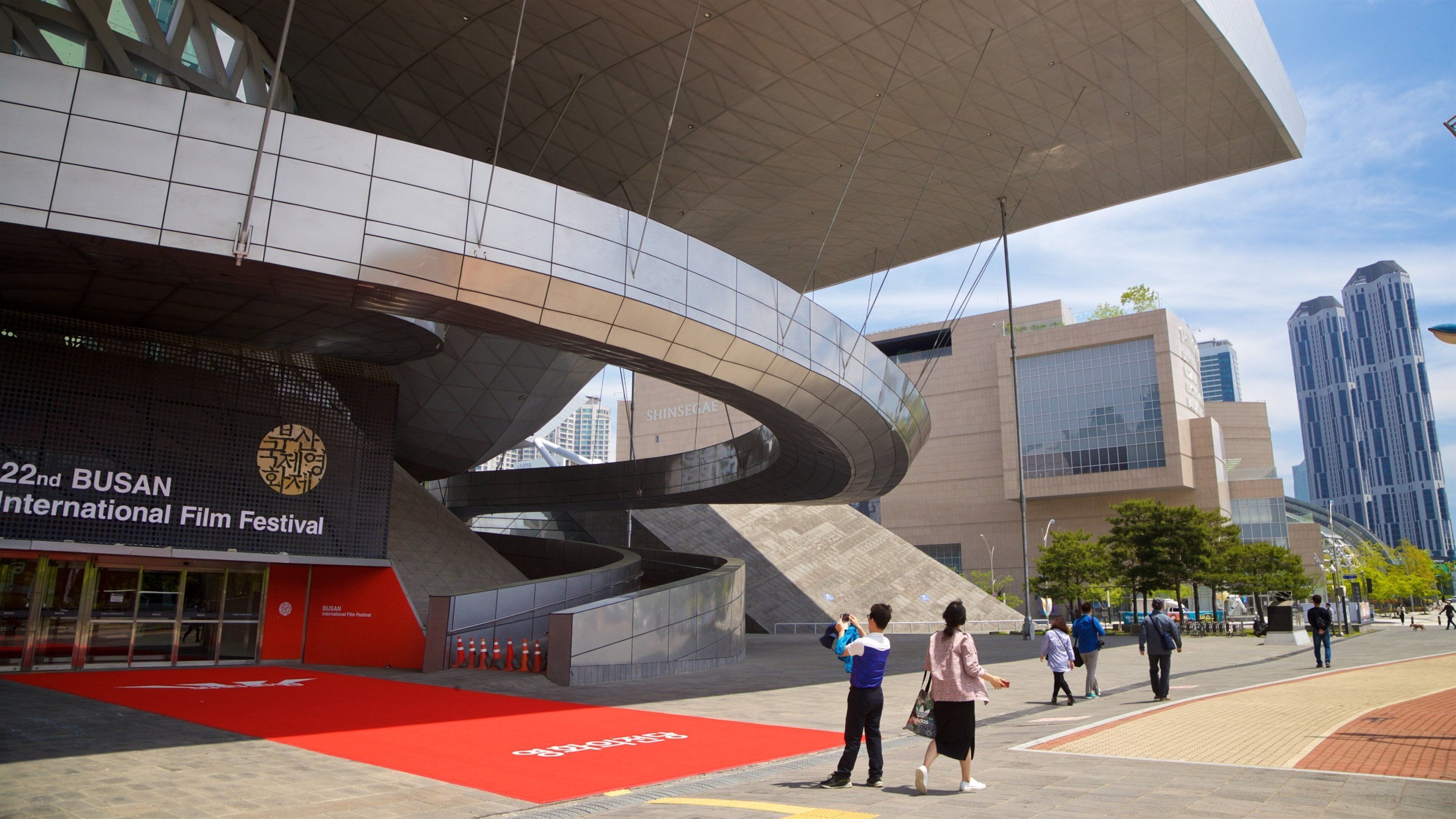 Busan Cinema Center featuring modern architecture as well as a couple