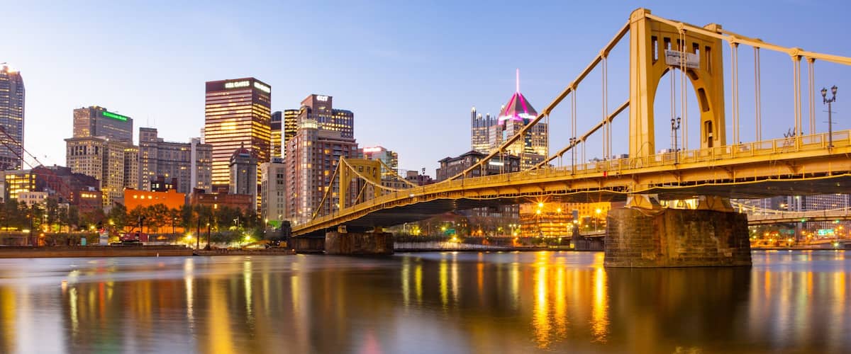 Andy Warhol Bridge featuring a river or creek, a city and a sunset