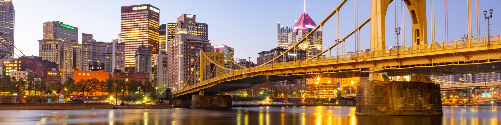 Andy Warhol Bridge featuring a river or creek, a city and a sunset
