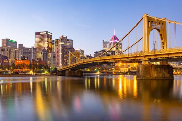 Andy Warhol Bridge featuring a river or creek, a city and a sunset
