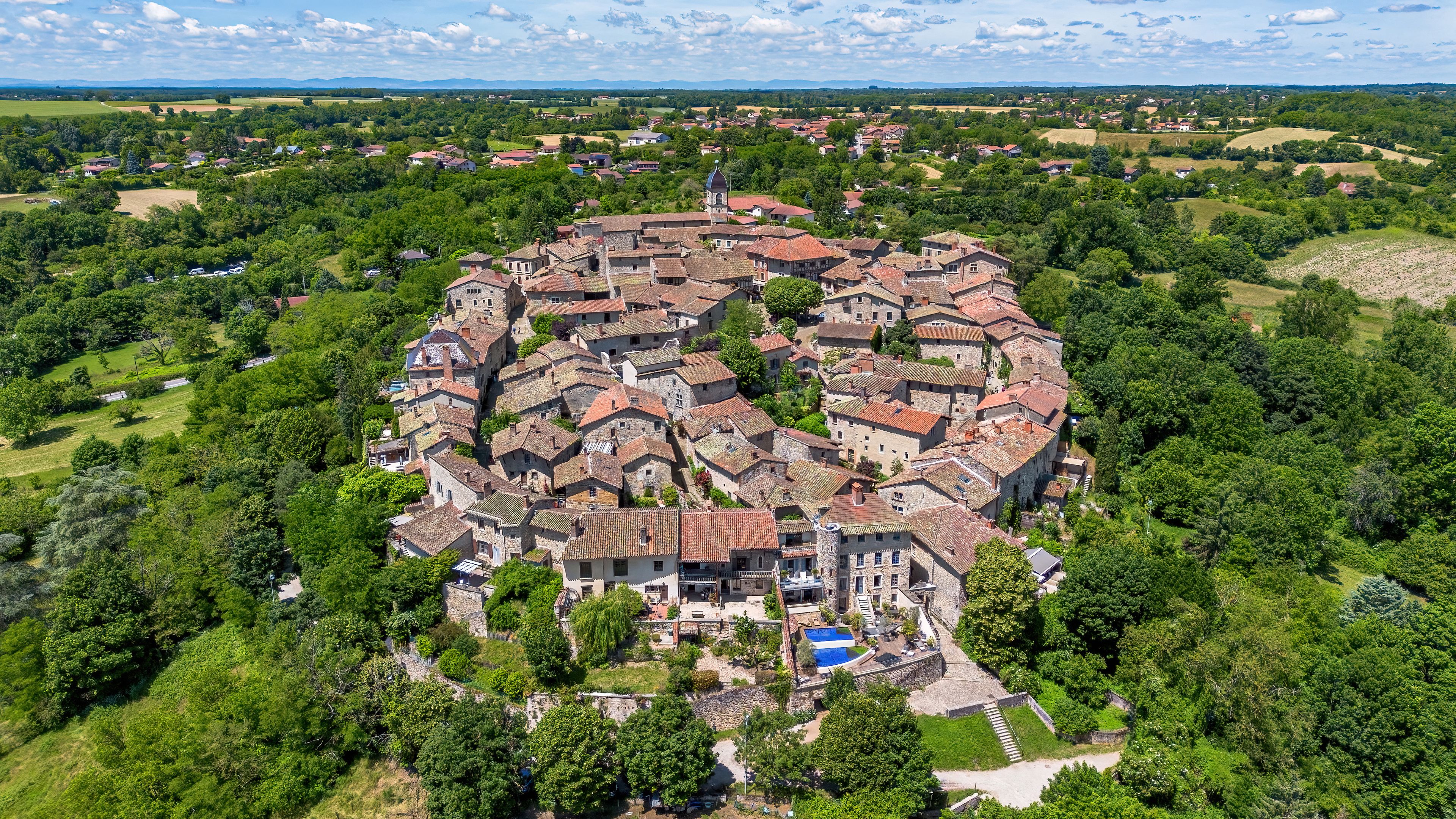 Aerial view of the lower gate of the medieval walled town of Pérouges in the French department of Ain near Lyon in the Auvergne-Rhône-Alpes region, France