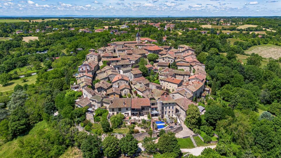 Aerial view of the lower gate of the medieval walled town of Pérouges in the French department of Ain near Lyon in the Auvergne-Rhône-Alpes region, France