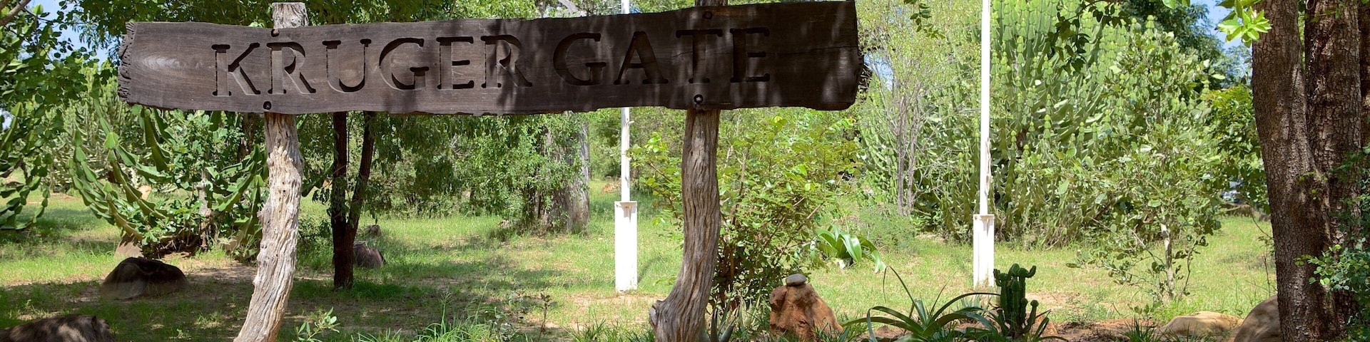 Paul Kruger Gate showing signage and a garden