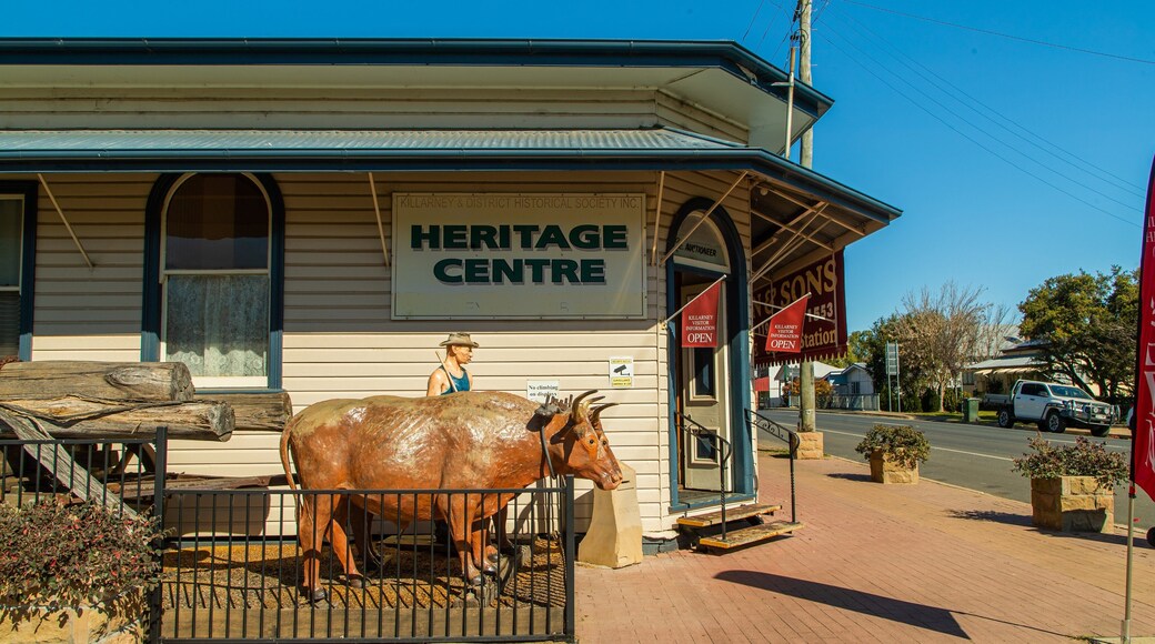 Killarney Heritage Centre featuring outdoor art, signage and a small town or village