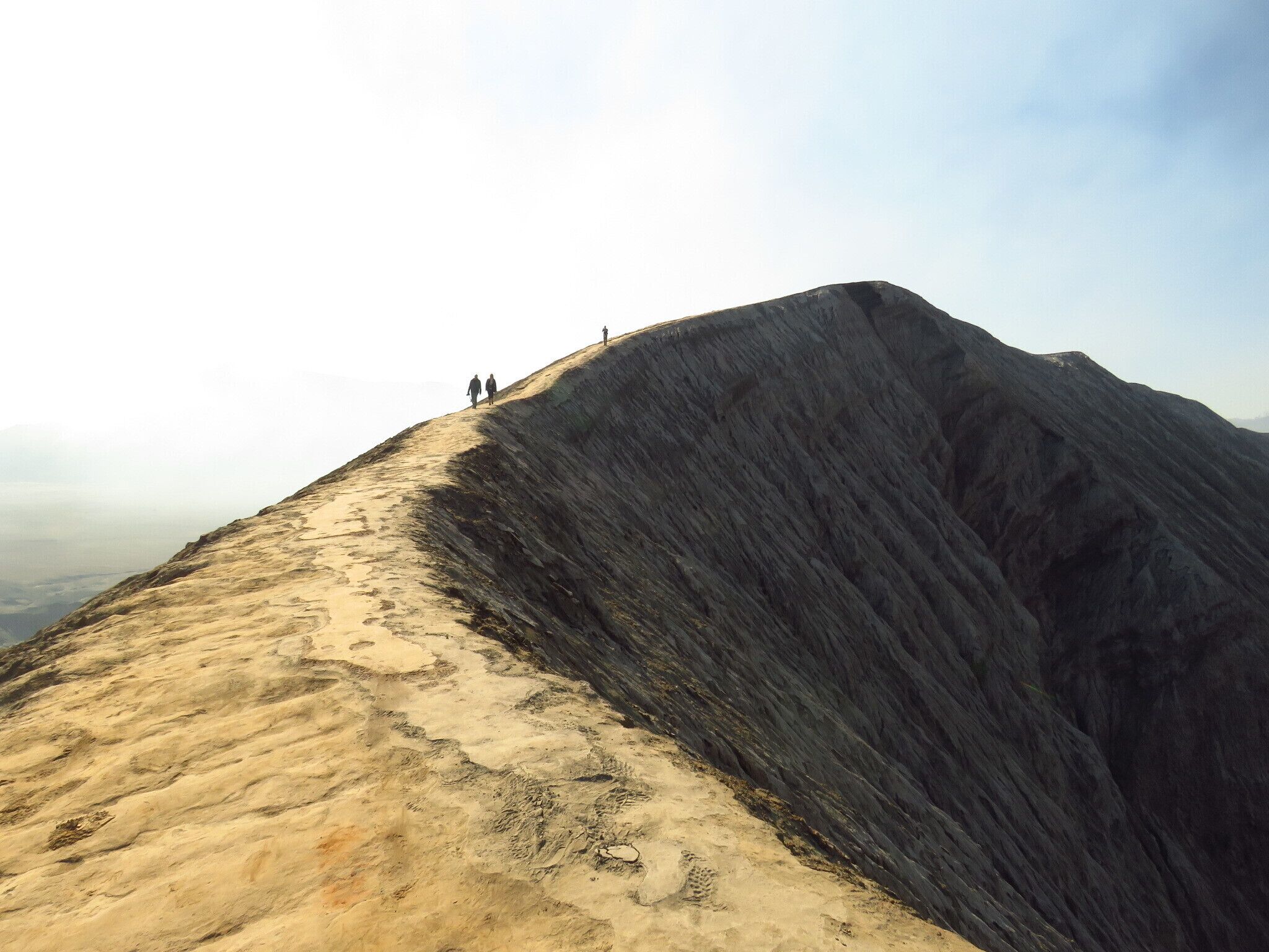 Tourists climb the crater of Mount Bromo, Java, Indonesia