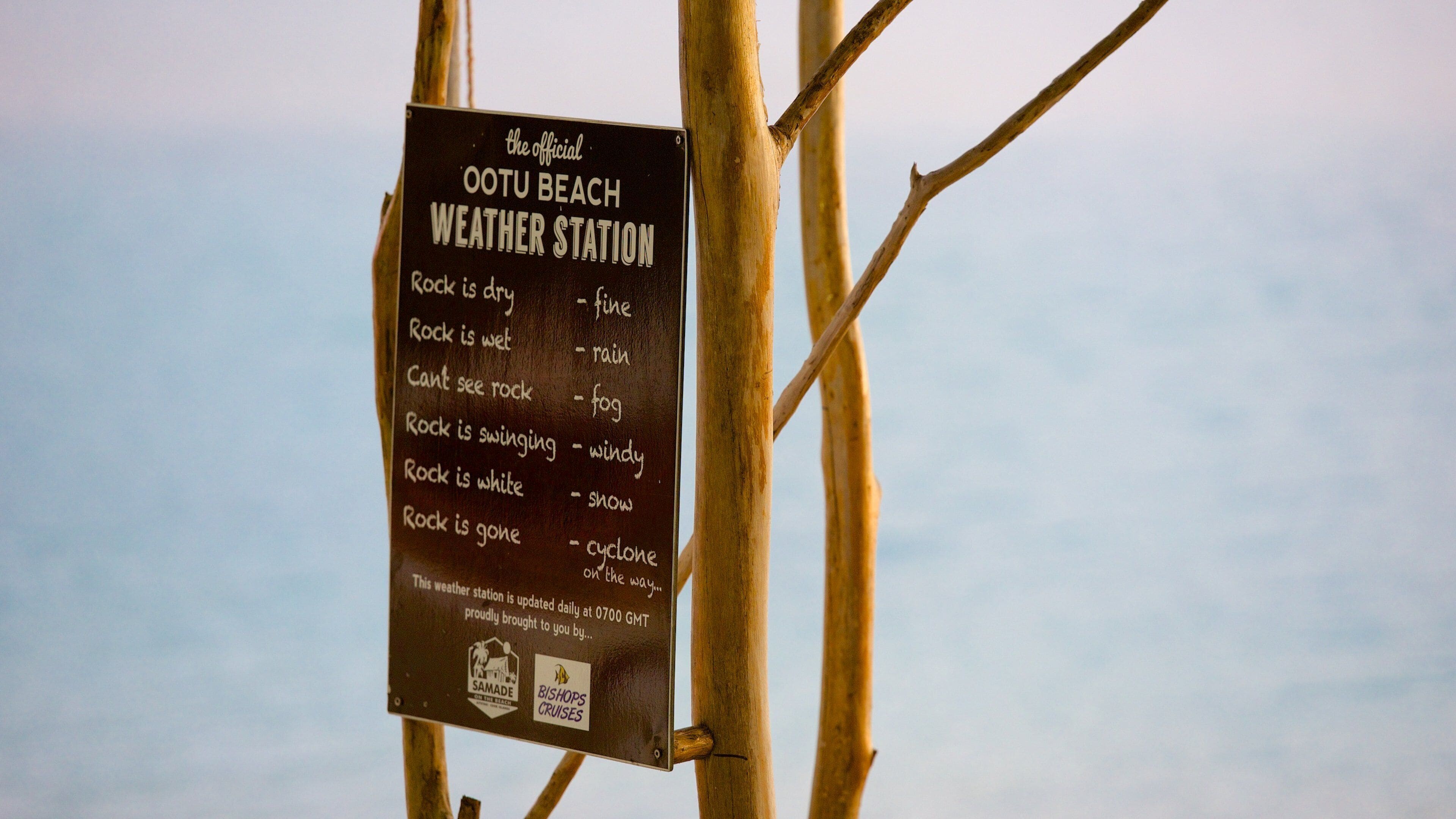 Aitutaki featuring general coastal views and signage
