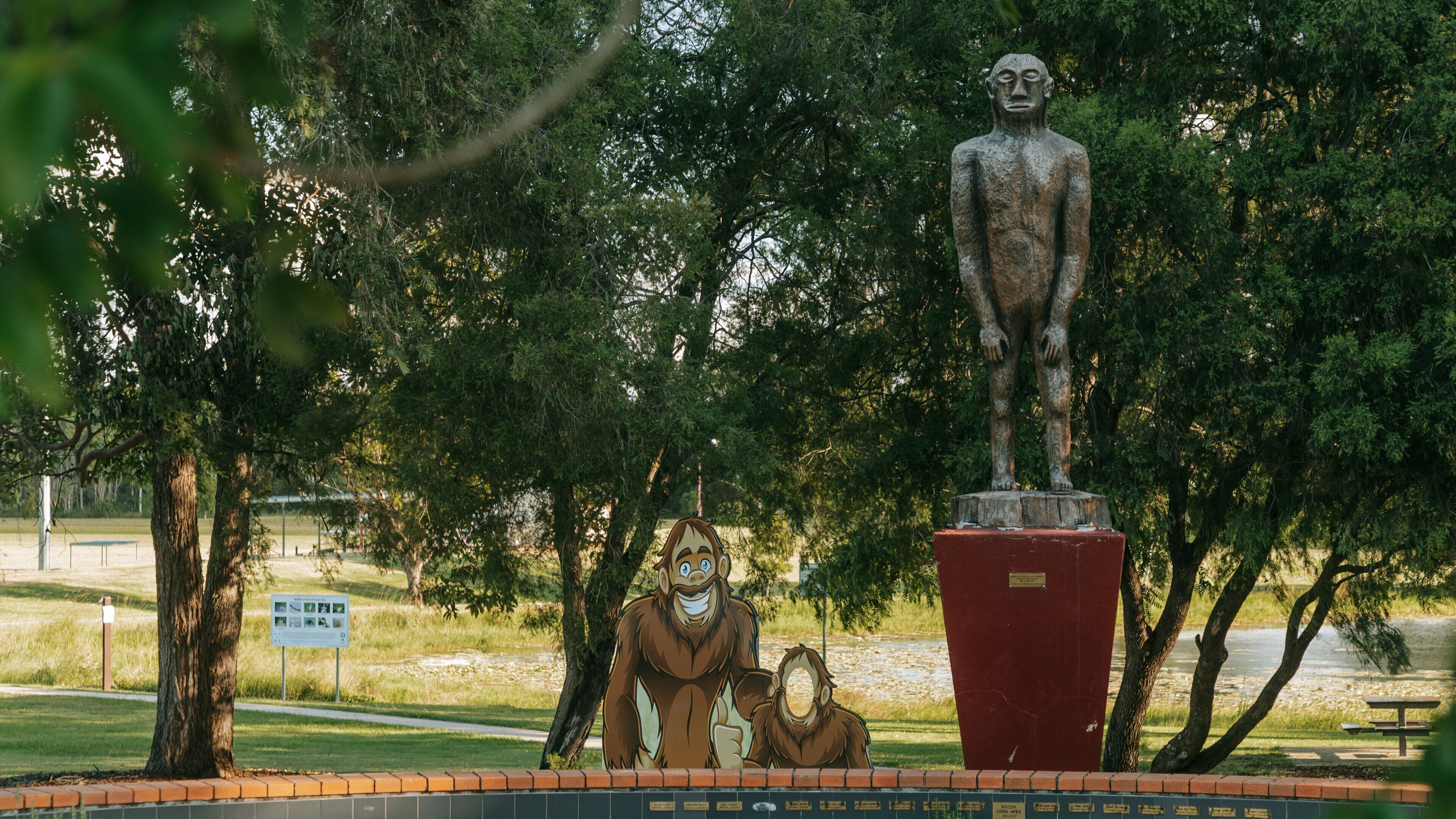 Yowie Park featuring a statue or sculpture, signage and outdoor art