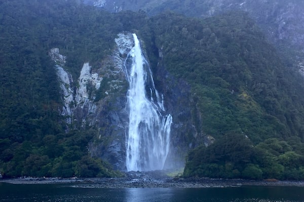 Milford Sound is a cliche must do for a good reason - it's awesome!! (Although I might like Doubtful sound "better". At least in comparing the actual sounds or fjords as they actually are). The upside to Milford - the drive there is beautiful and in Milford you can also kayak and check out the underwater observatory... Ooo and you get to go under Stirling Falls, which was amazing!
This is Bowen falls which is the other permanent waterfall in Milford Sound.
The day I was there was so sunny, and it was beautiful, the guides even said they never see it that clear and sunny! However, Milford is supposed to be even more magical in the rain because then hundreds of small waterfalls appear everywhere. The one time rain would've been good! Lol