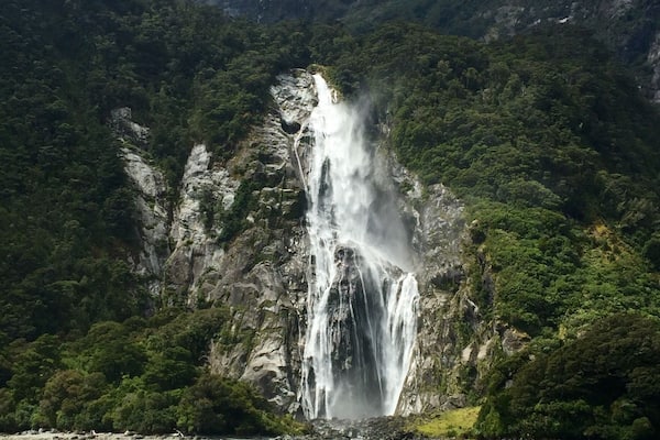 Milford Sound is a cliche must do for a good reason - it's awesome!! (Although I might like Doubtful sound "better". At least in comparing the actual sounds or fjords as they actually are). The upside to Milford - the drive there is beautiful and in Milford you can also kayak and check out the underwater observatory... Ooo and you get to go under Stirling Falls, which was amazing!
This is Bowen falls which is the other permanent waterfall in Milford Sound.
The day I was there was so sunny, and it was beautiful, the guides even said they never see it that clear and sunny! However, Milford is supposed to be even more magical in the rain because then hundreds of small waterfalls appear everywhere. The one time rain would've been good! Lol