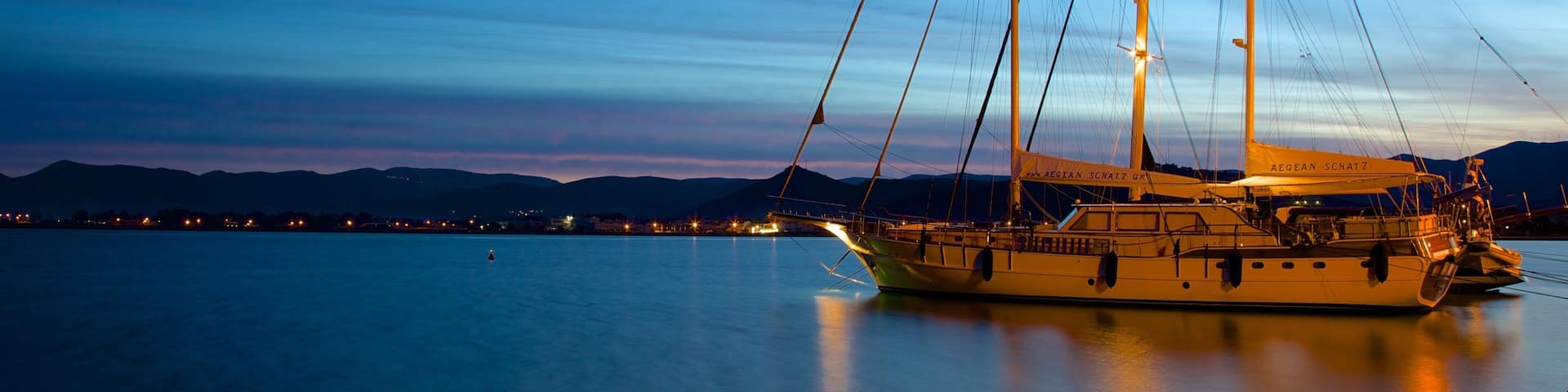 Nafplio showing a bay or harbor and night scenes