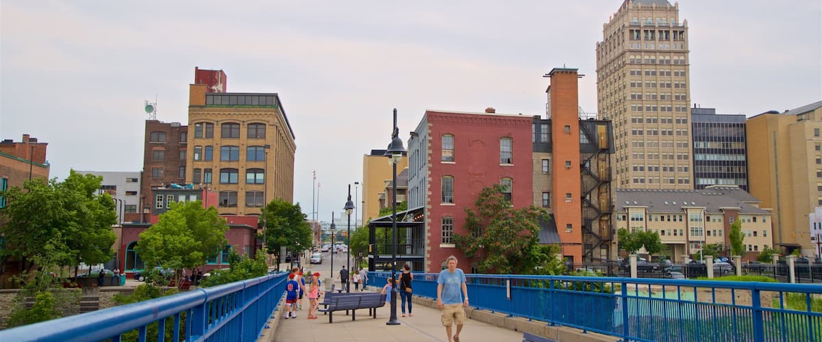 Pont de Rennes Bridge which includes a bridge and a city as well as a small group of people