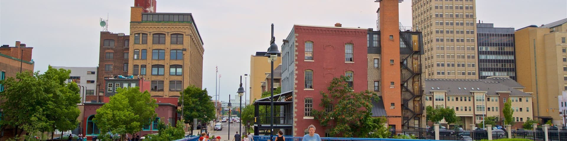 Pont de Rennes Bridge which includes a bridge and a city as well as a small group of people