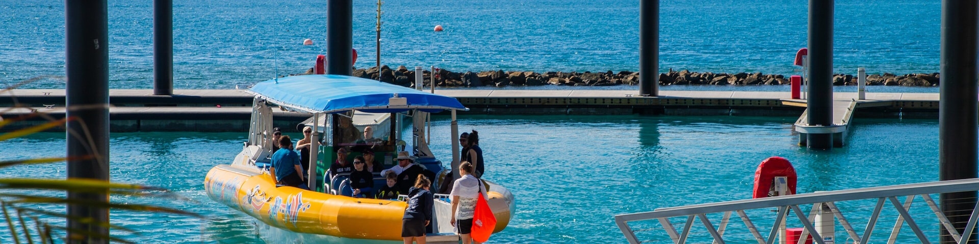 Daydream Port featuring a bay or harbor and boating as well as a small group of people