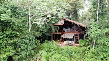 El Remanso Lodge is location in a pristine forest just outside Corcovado National Park in Costa Rica. This room is La Vainilla, and it was beautiful. All open air, it overlooked both the forest and Pacific Ocean. Animals and birds galore. Two queen size beds and two twin beds, two stories and a beautiful balcony. Highly recommended!