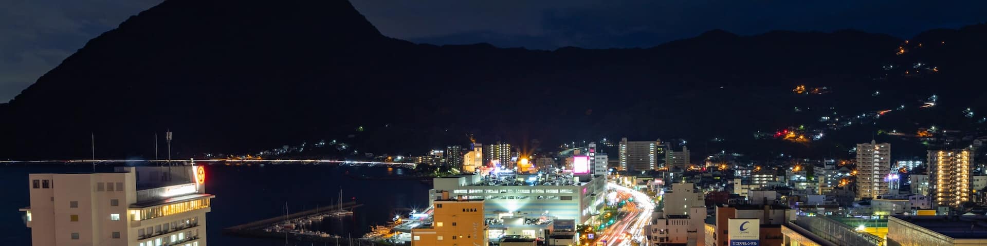 Beppu Tower which includes a city, night scenes and landscape views
