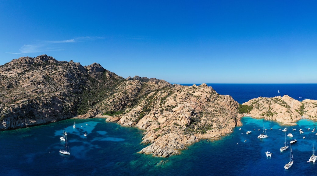 Stunning panoramic view of Cala Coticcio also known as Tahiti with its rocky coasts and small beaches bathed by a turquoise cllear water. La Maddalena Archipelago, Sardinia, Italy.
