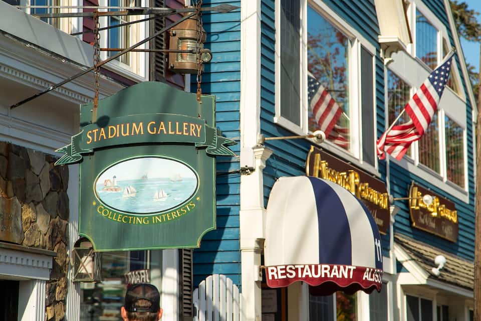 A building with a sign reading "Stadium Gallery" and another sign for "Aliss Restaurant".