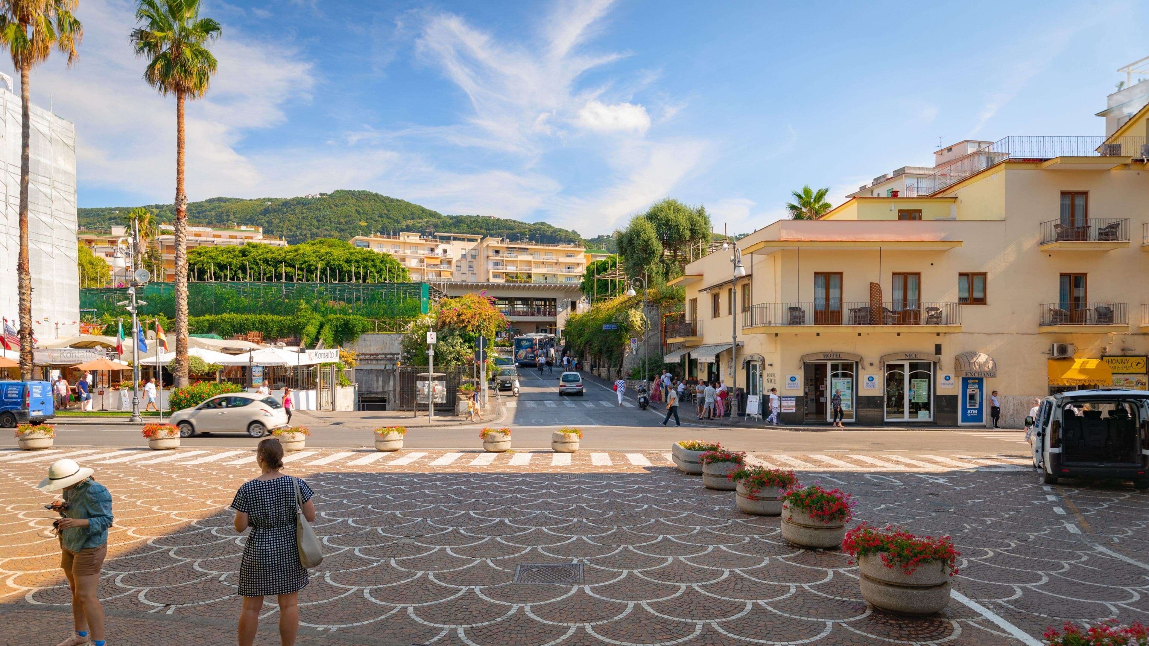 Piazza Lauro featuring flowers and street scenes as well as a couple