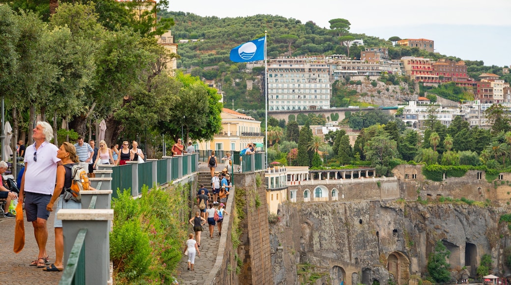 Sorrento Lift featuring a coastal town and landscape views as well as a small group of people