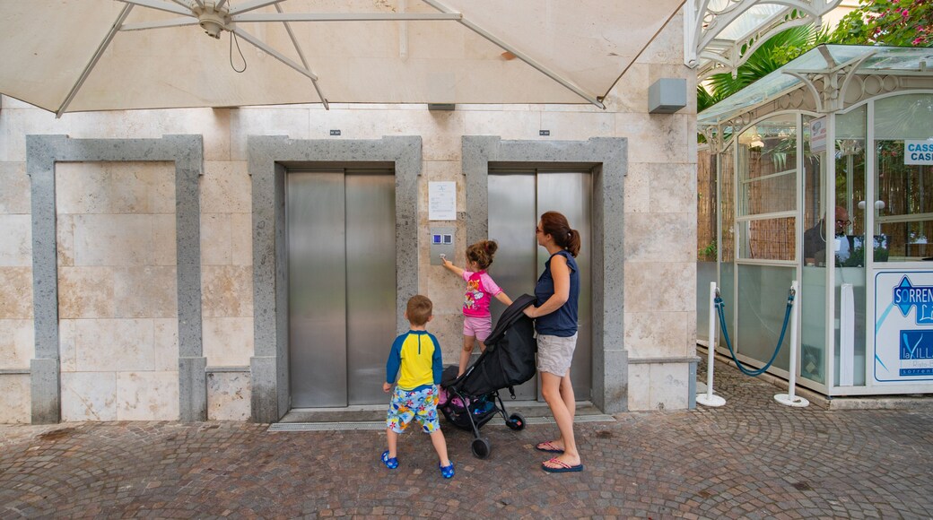 Sorrento Lift featuring street scenes as well as a family