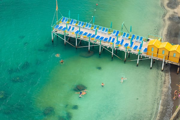 Sorrento Lift showing general coastal views and swimming as well as a small group of people