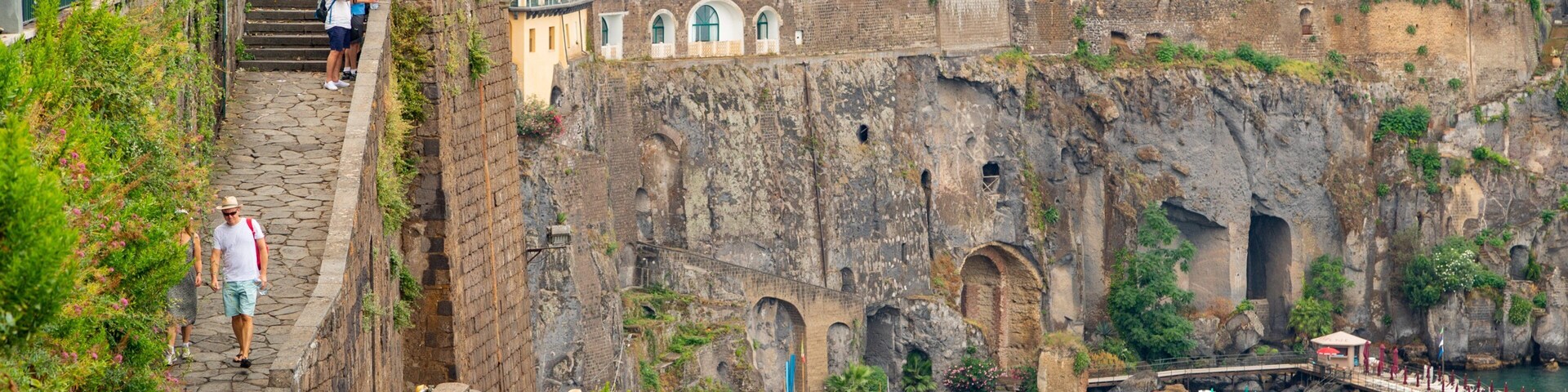 Sorrento Lift showing a coastal town and a bay or harbor as well as a small group of people