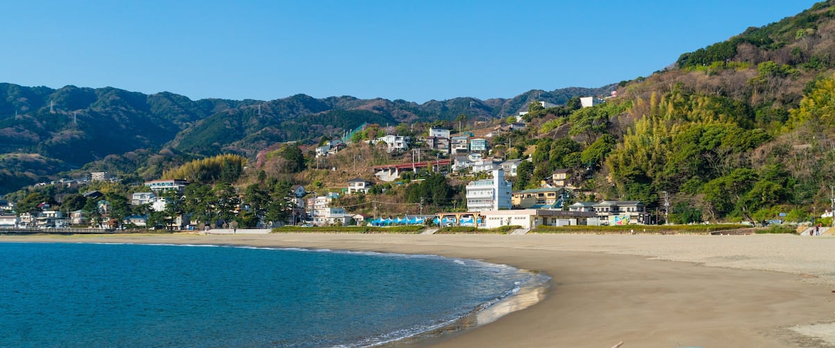Nagahama Beach which includes a beach, a coastal town and general coastal views