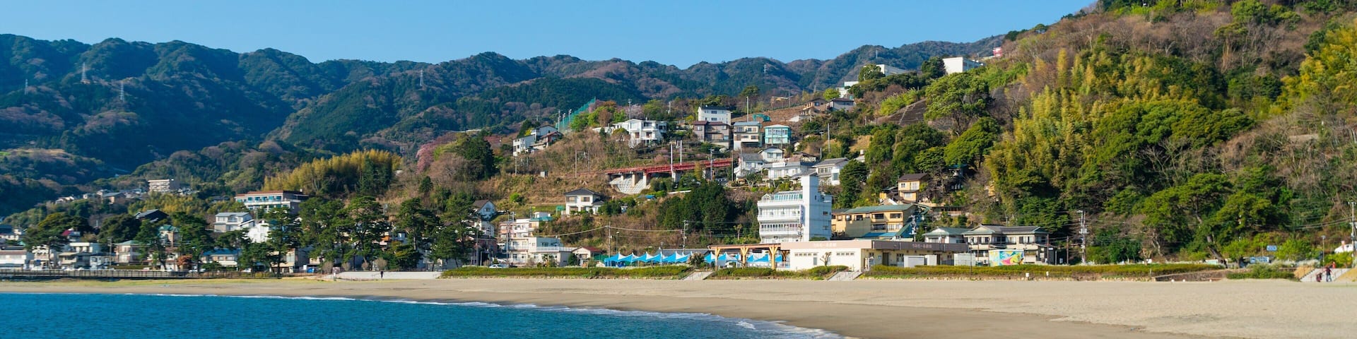 Nagahama Beach which includes a beach, a coastal town and general coastal views