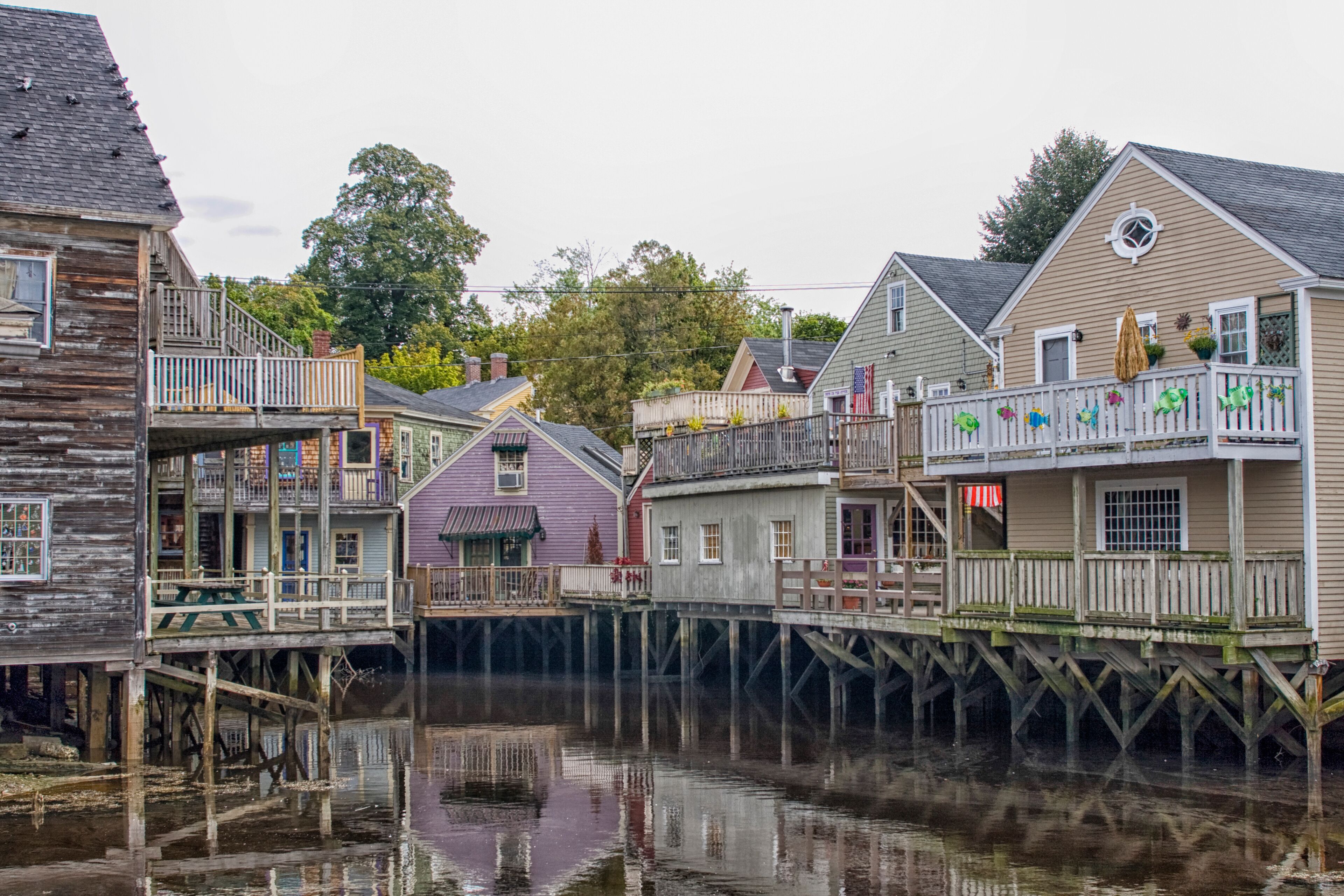 Backside of wooden houses over water