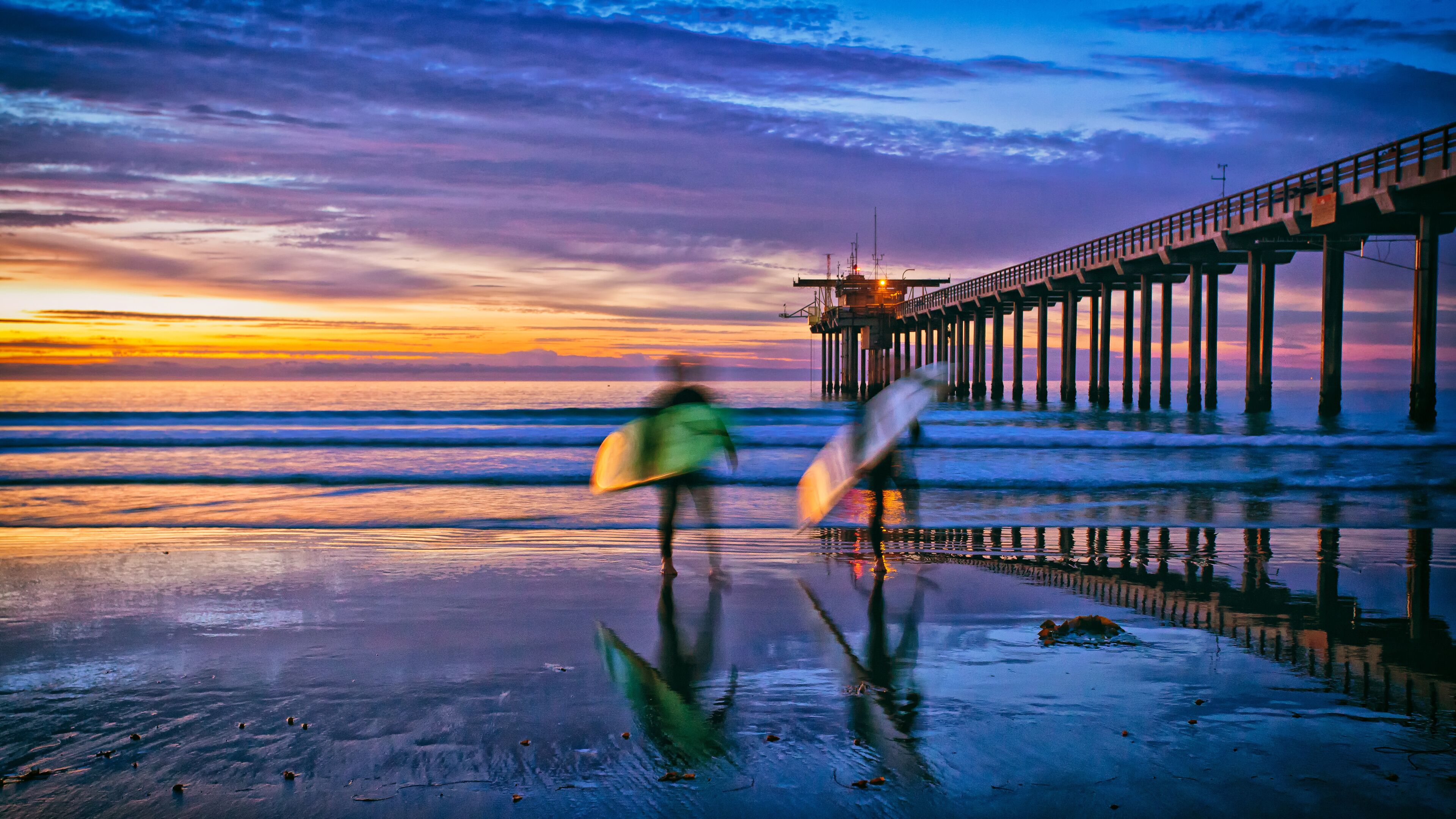beach sunset with surfers and pier, La Jolla, San Diego, CA