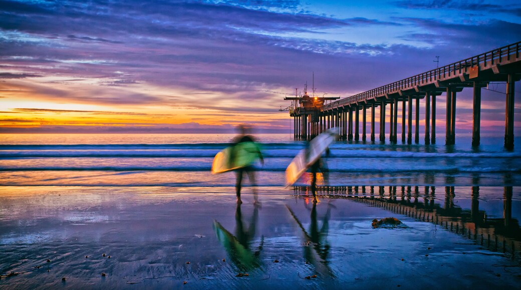 beach sunset with surfers and pier, La Jolla, San Diego, CA