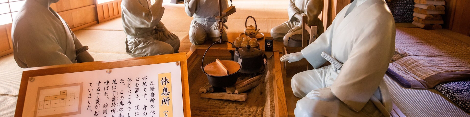 Hakone Checkpoint Museum featuring signage, a statue or sculpture and interior views