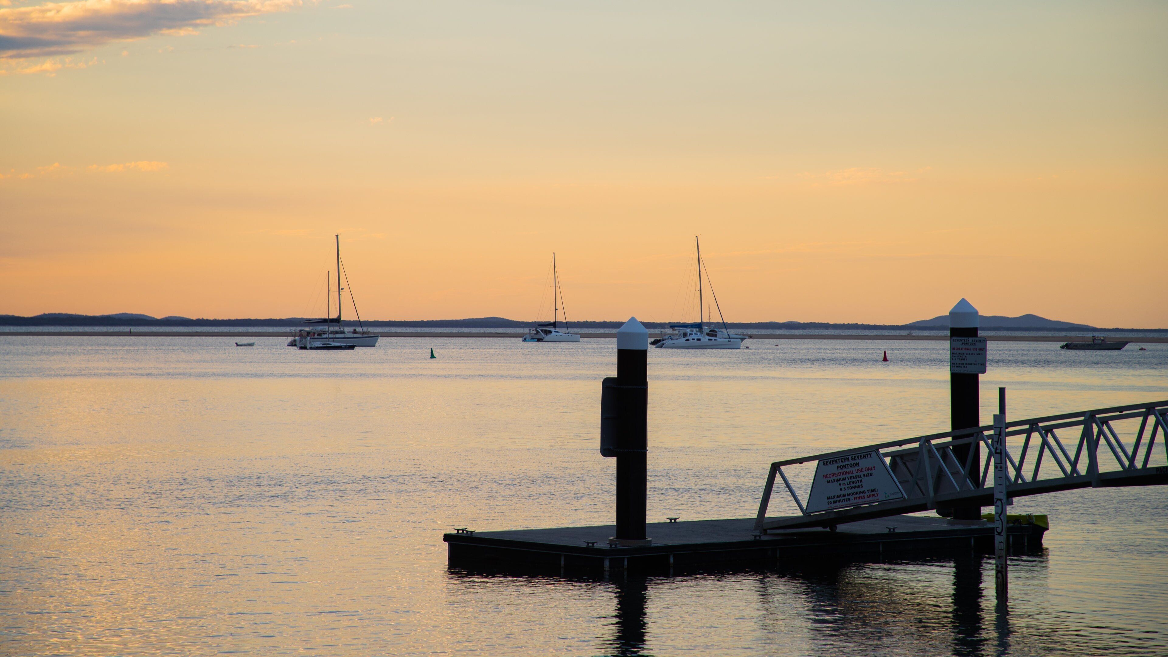 1770 Marina showing a sunset and a bay or harbor