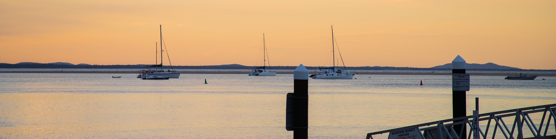 1770 Marina showing a sunset and a bay or harbor