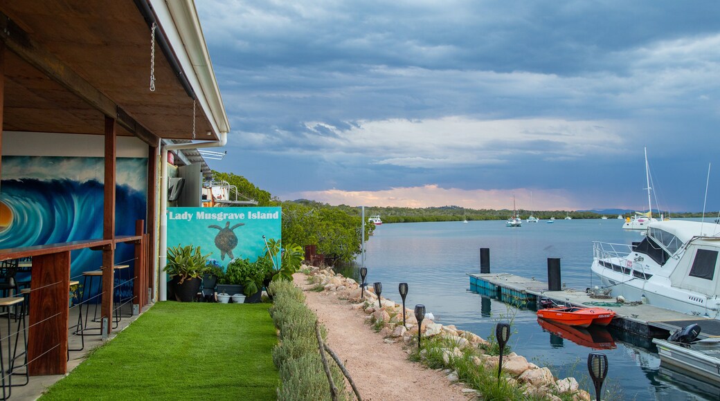 1770 Marina which includes a sunset and a bay or harbor