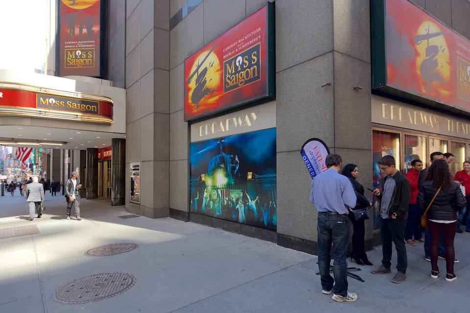 A theater with a large poster advertising Miss Saigon.