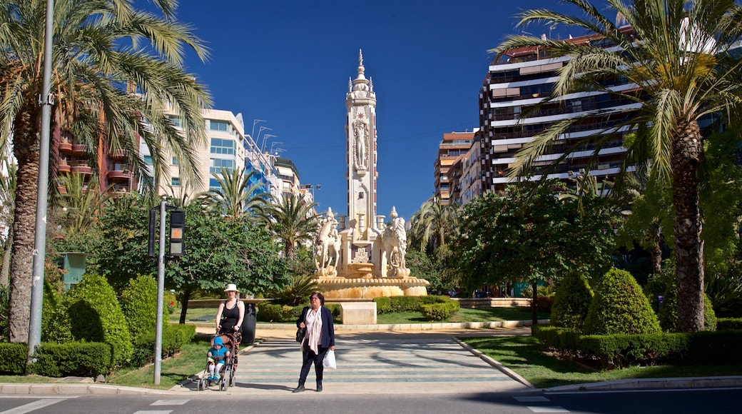 Placa de los Luceros showing a garden, a fountain and street scenes