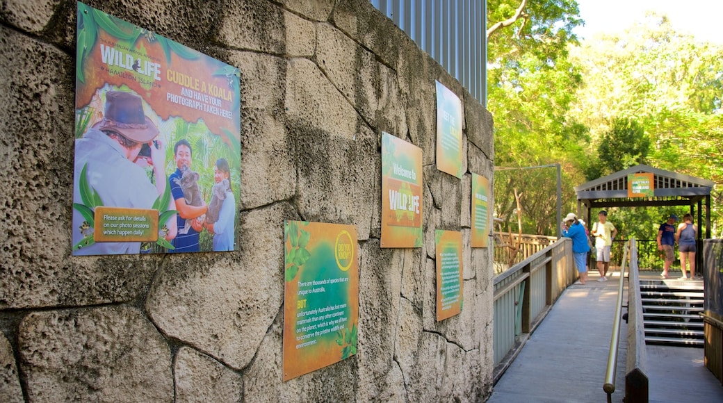 WILD LIFE Hamilton Island showing signage as well as a small group of people