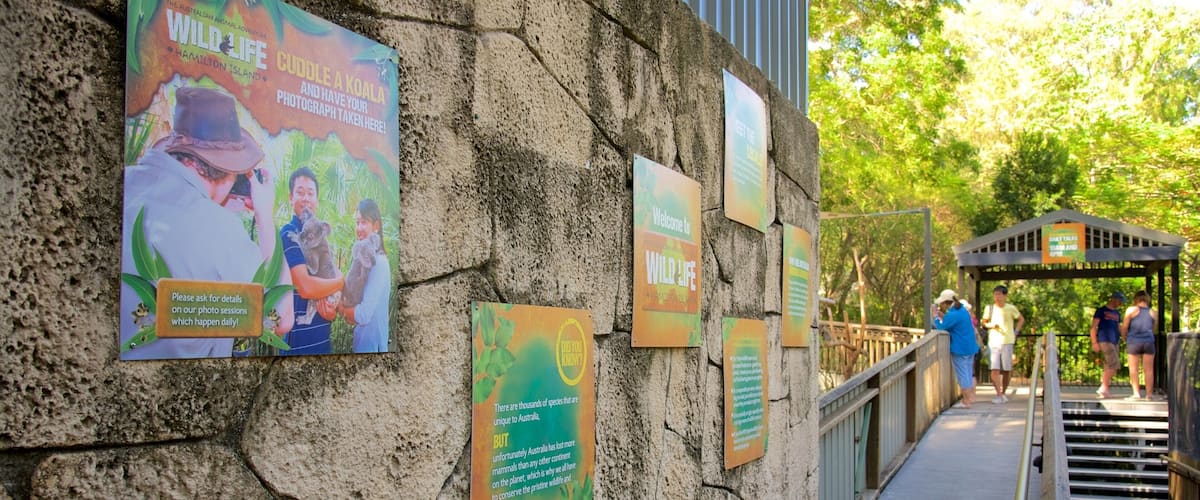 WILD LIFE Hamilton Island which includes signage as well as a small group of people
