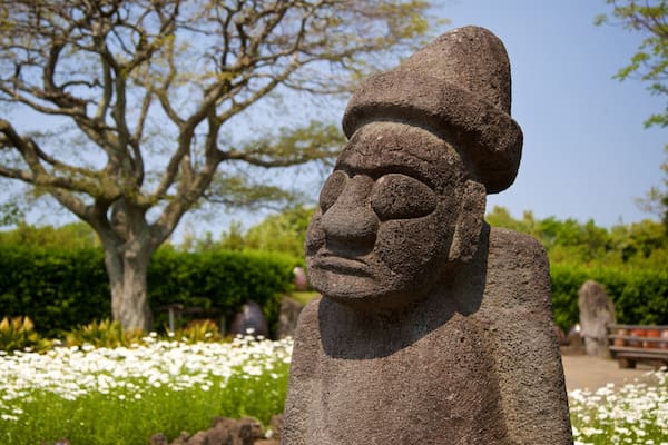 Jeju Folk Village Museum which includes a statue or sculpture, wildflowers and heritage elements